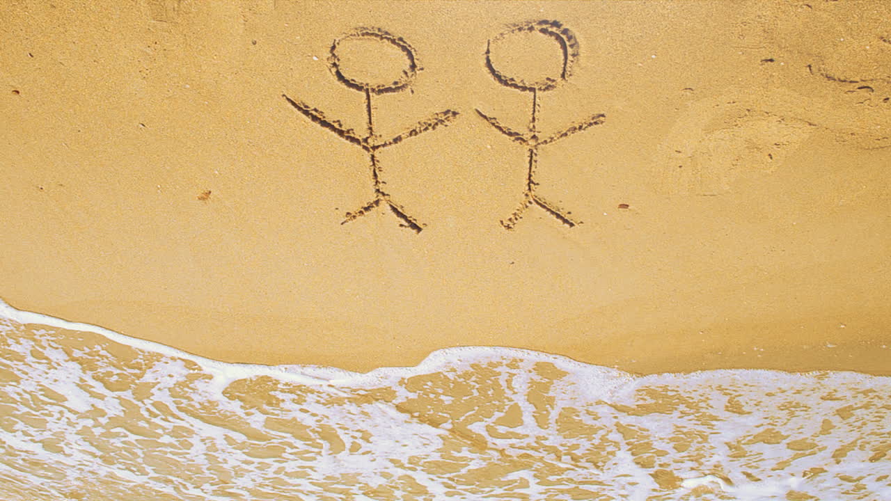 The drawing of tourists on the beach. Shooting on the beach