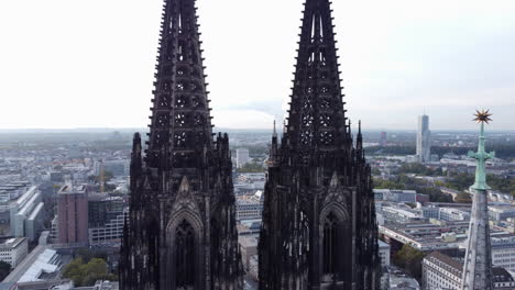 close up gothic twin spires of cologne cathedral aerial dolly out