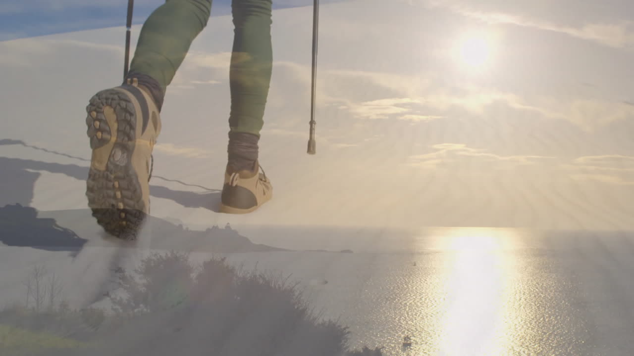 Female hiker trekking on snowy coastal trail, with animated health icons and progress chart