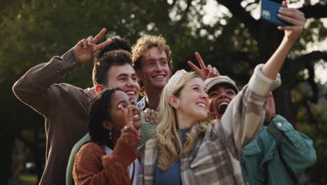 a group of friends taking a selfie outdoors