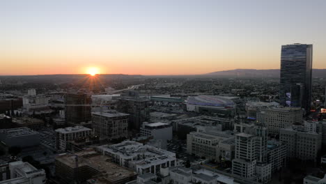 sunset over the los angeles skyline with crypto.com arena