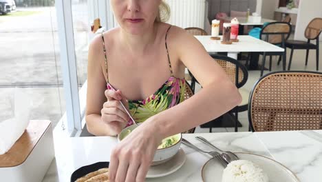 woman enjoying thai green curry