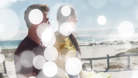 couple leaning against yellow convertible on coastal road, showing travel stats with animated icons