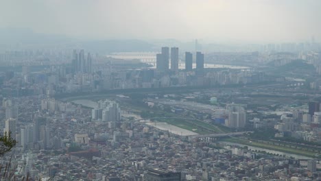 panorama of seoul skyline on a misty day from achasan mountain in south korea