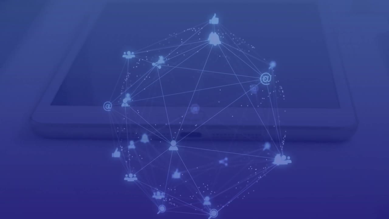 Animation of connected dots forming globe over overhead view of digital tablet and laptop on table
