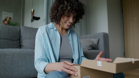 woman unboxing a package at home