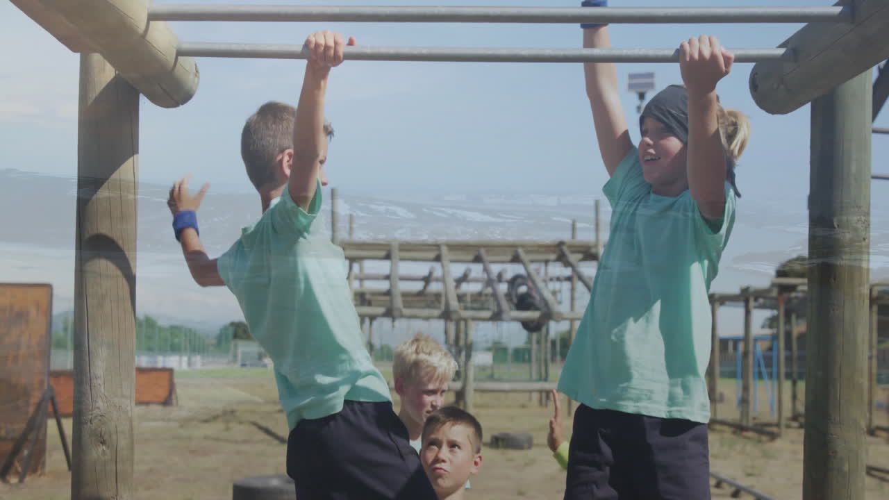 Playing on monkey bars, children enjoying animation at outdoor school playground