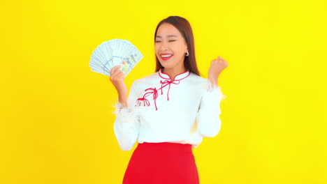 pretty girl feeling excited, holding paper money