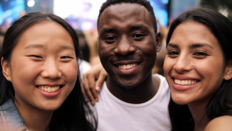 a joyful moment captured: three friends radiate happiness amidst a vibrant celebration in a colorful outdoor setting, sharing smiles and friendship together