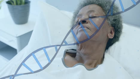 animation of dna strand over senior african american female patient sleeping in hospital bed