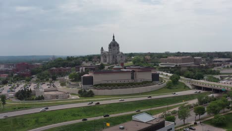 Low-super-wide-aerial-shot-flying-over-Saint-Paul-towards-the-immense-Cathedral-of-Saint-Paul-in-Minnesota