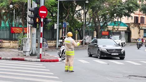 traffic officer managing busy hanoi intersection