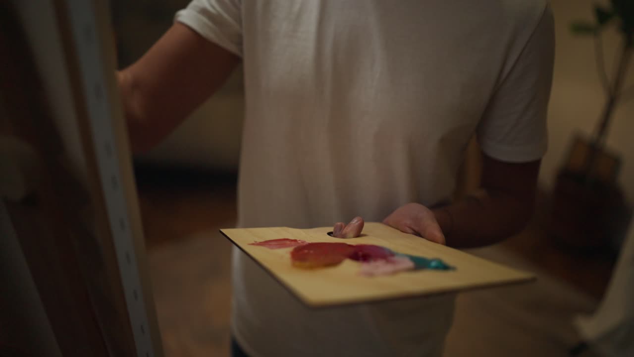 Artist painting with a palette knife