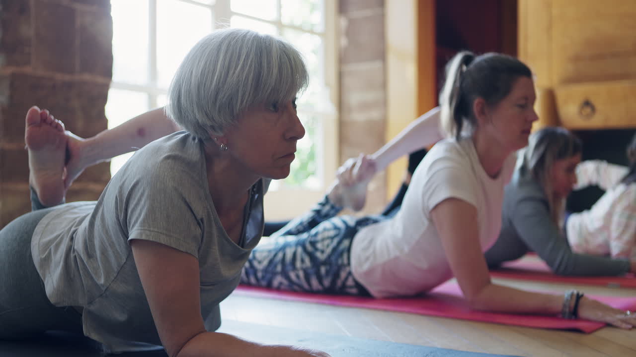 Group of women doing yoga exercise