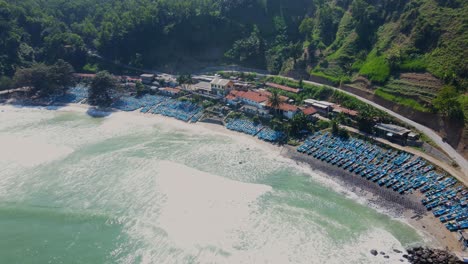 Drone-footage-of-Fishermen's-Terminal-at-Menganti-Beach,-indonesia