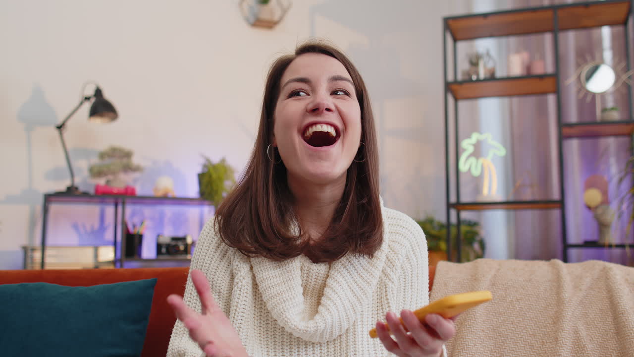 Winner young woman use smartphone typing browsing found out great win good news celebrate victory