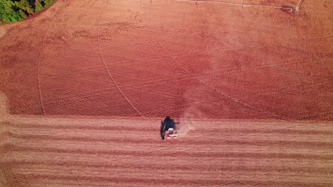 Drop-down-view-of-Harvesting-soybeans-using-a-Soybean-combine-harvester-in-rural-Georgia,-USA