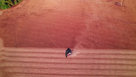 drop down view of harvesting soybeans using a soybean combine harvester in rural georgia, usa