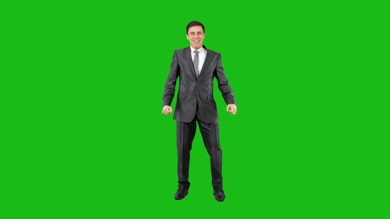 Excited man celebrating victory in studio. Chroma key