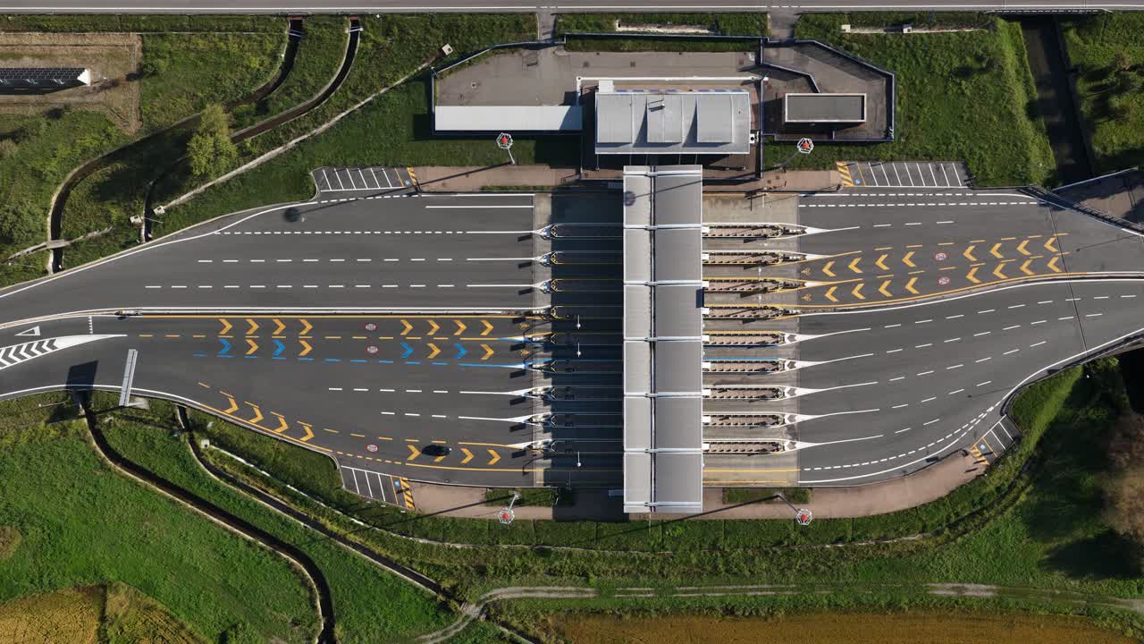Toll gates, taxes on driving in Italy, Italy highway. Northern Italy. Top down aerial drone video. Transportation and mobility
