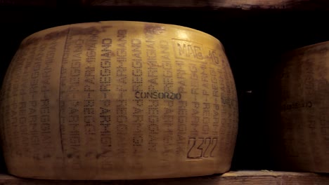 parmesan lying, ripening on the shelf