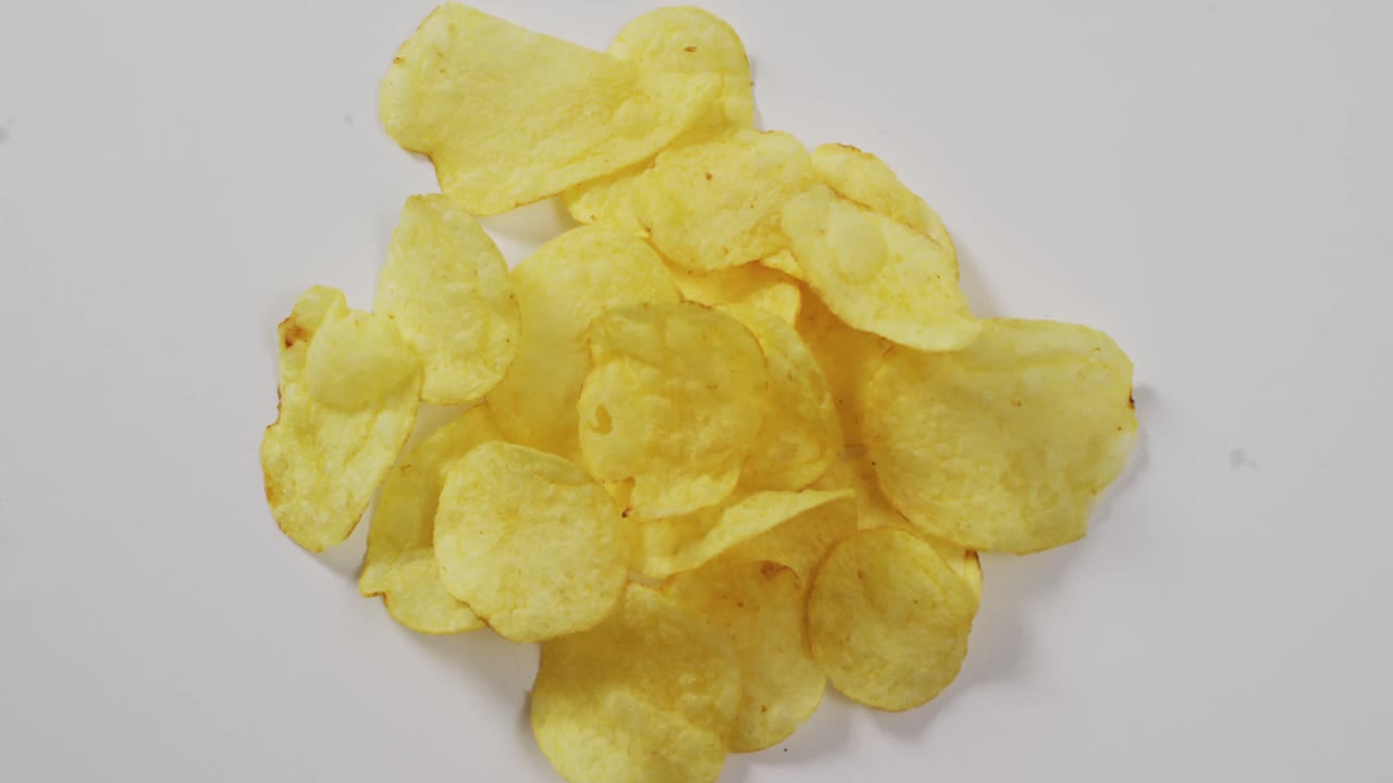 Close up of potato chips with copy space on white surface