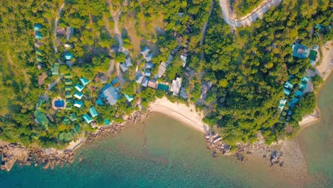 4k drone footage of the beach at mae nam on koh samui in thailand, including beachfront resorts with beautiful clouds in the sky and crystal teal water