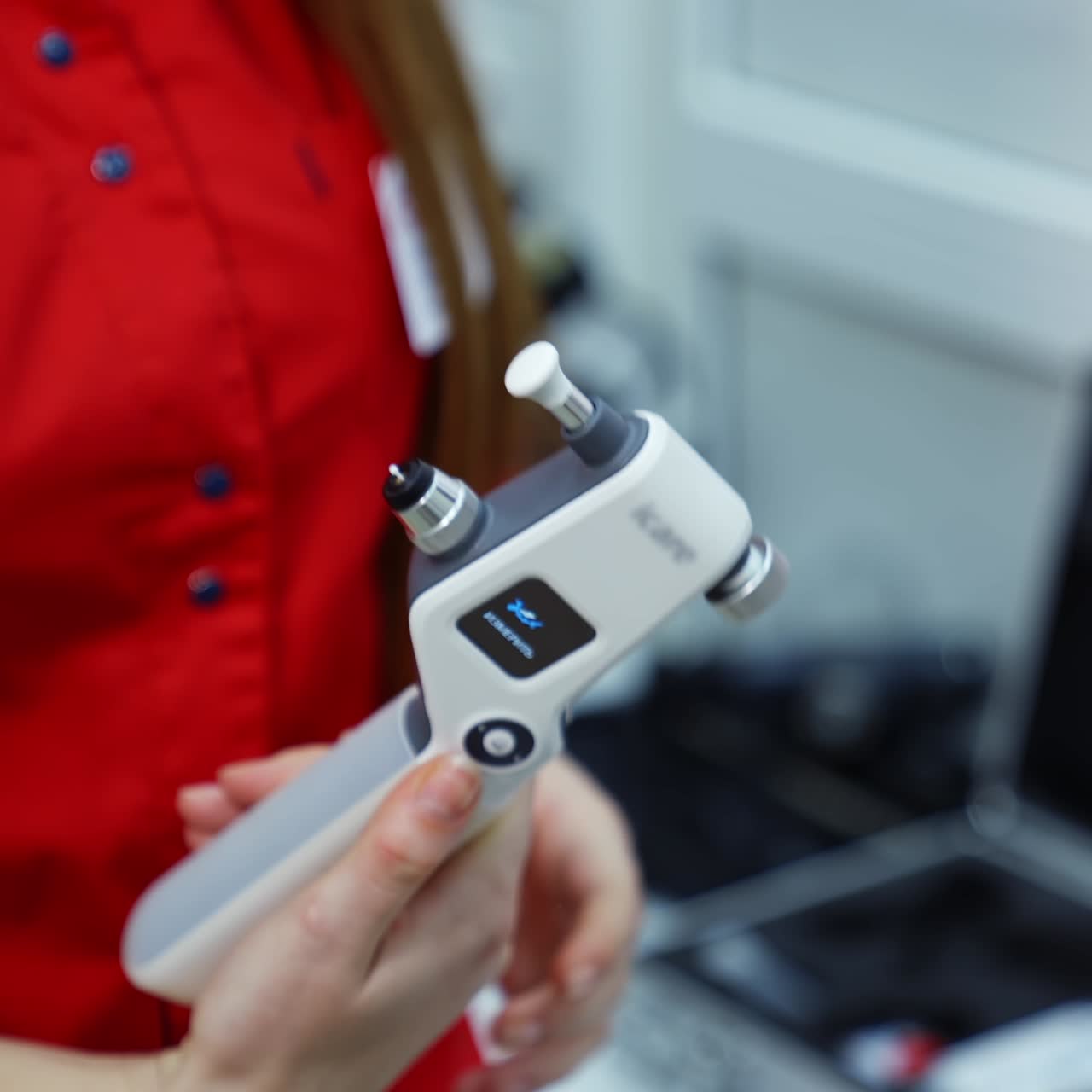 Modern device for eye checking. Optical tool in doctor's hands. Female ophthalmologist holding medical instrument in clinic