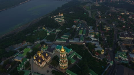 Bell-tower-Kiev-Pechersk-Lavra-on-Dnieper-shore-from-drone-above