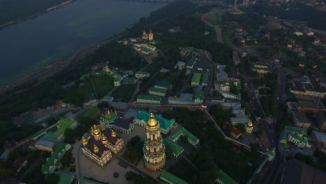 bell tower kiev pechersk lavra on dnieper shore from drone above