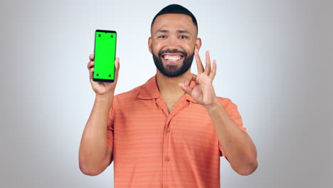 Phone,-green-screen-and-man-with-okay