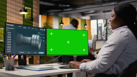 female technician using cad tool for wind turbines on isolated screen computer