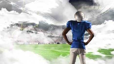 american football athlete standing near the field goal