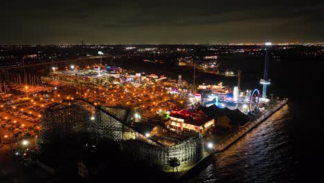 galveston, texas - march 1, 2023: aerial drone view of the pleasure pier of the city at night