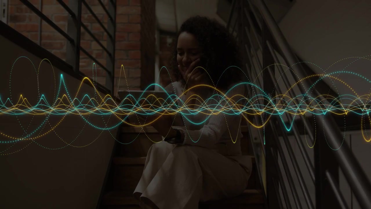 Woman sitting on stairs tapping device and shifting waveform while previewing audio for marketing
