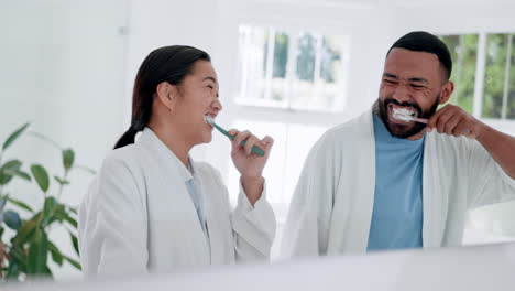 bathroom, mirror and couple brushing teeth