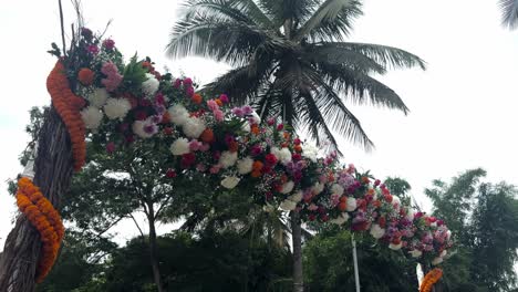 colorful flower ornaments at the outdoor indian wedding in bengaluru, india. low angle shot