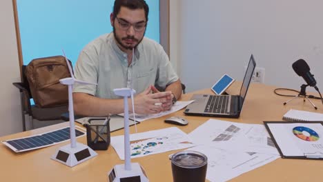 thoughtful engineer in a meeting about renewable energy sources