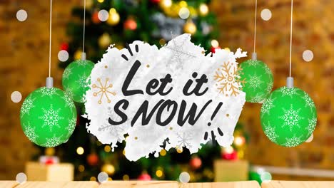 animation of let it snow christmas text and baubles on blurred decorations in background