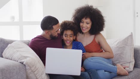 Family-having-a-video-call-on-a-laptop-at-home