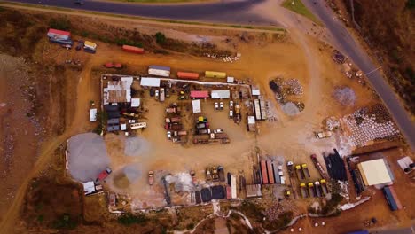 drone top shot static of a construction project machinery lot in asokoro, abuja, africa.