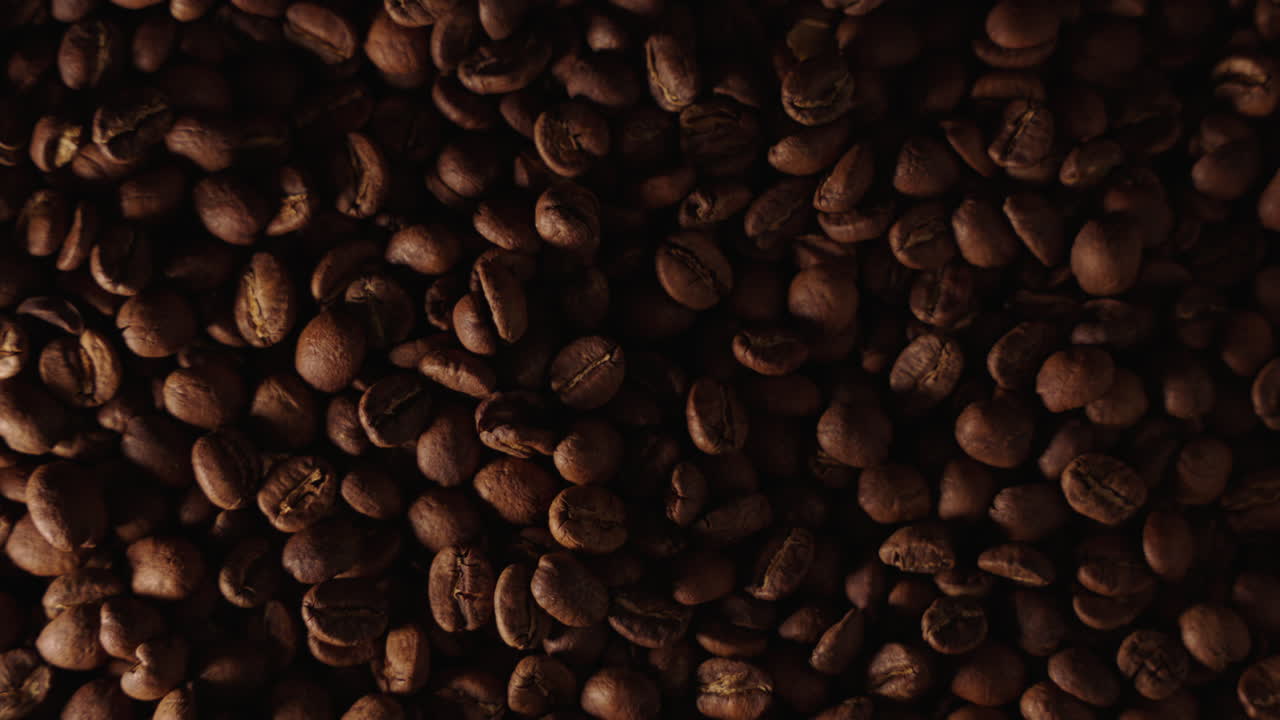 Top down slow motion shot of coffee beans