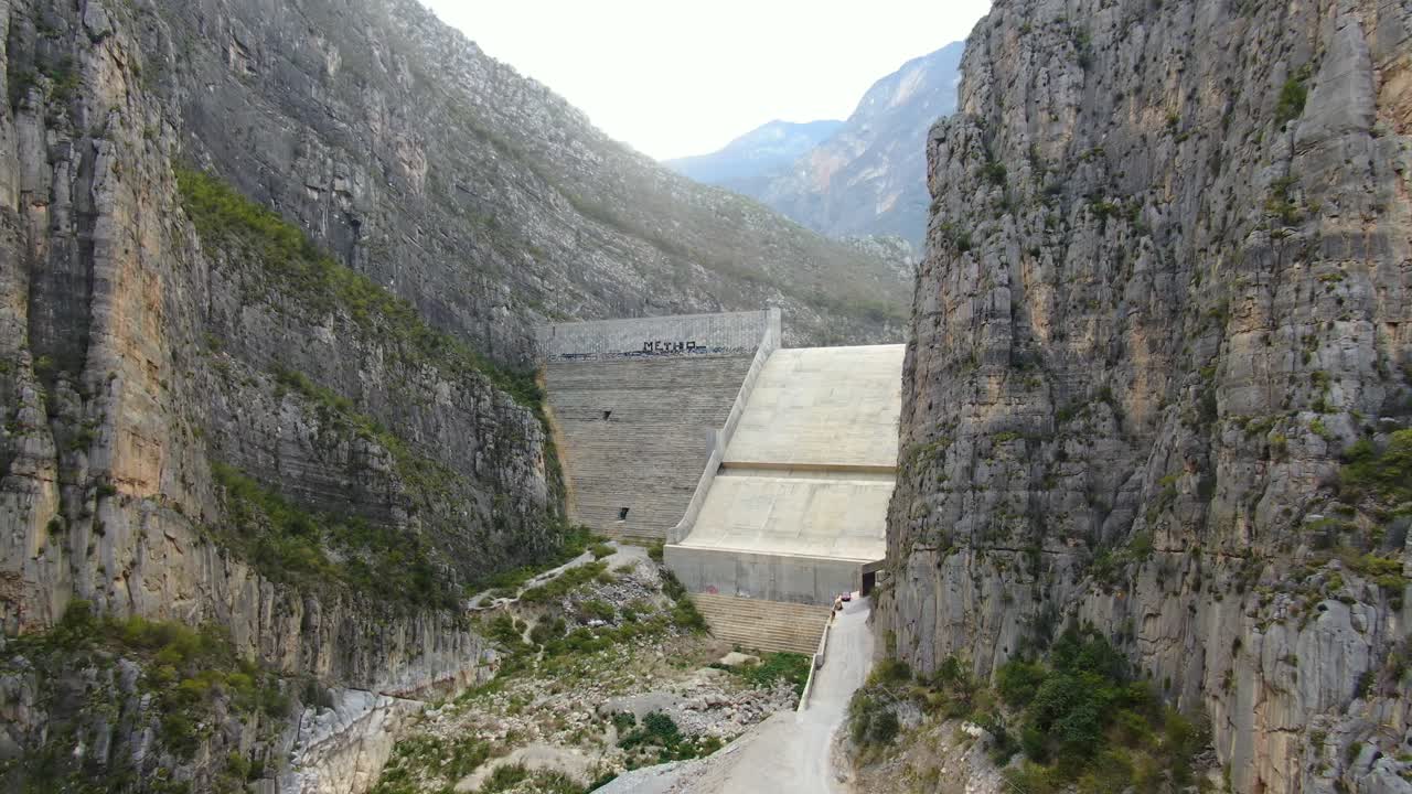 Aerial View of a Dam in a Mountainous Canyon
