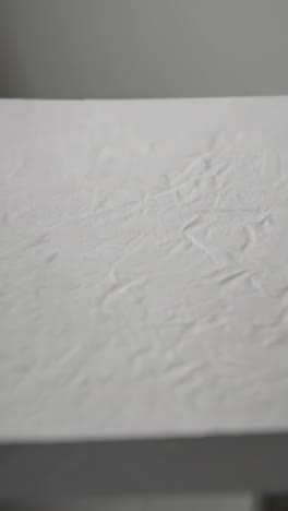 subtle white textured background with shallow depth of field