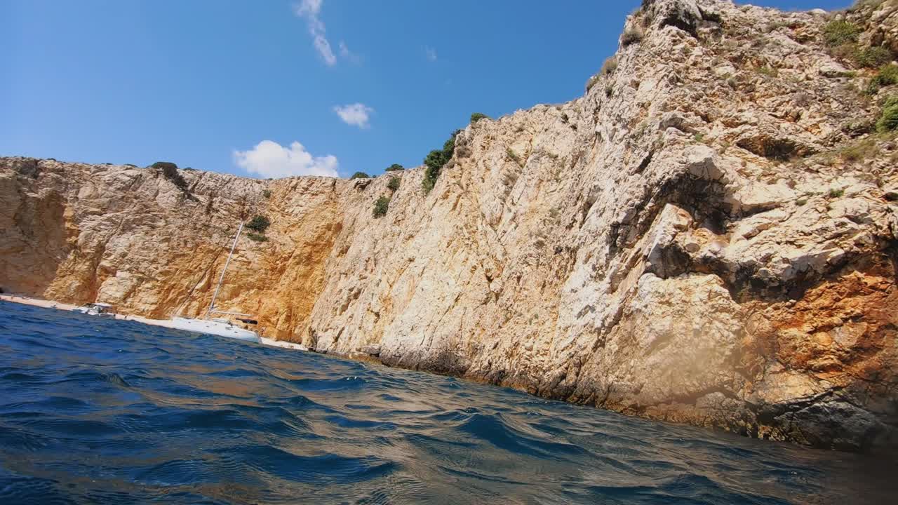 Point of view of a man floating on sea surface in Krk island coast, Croatia