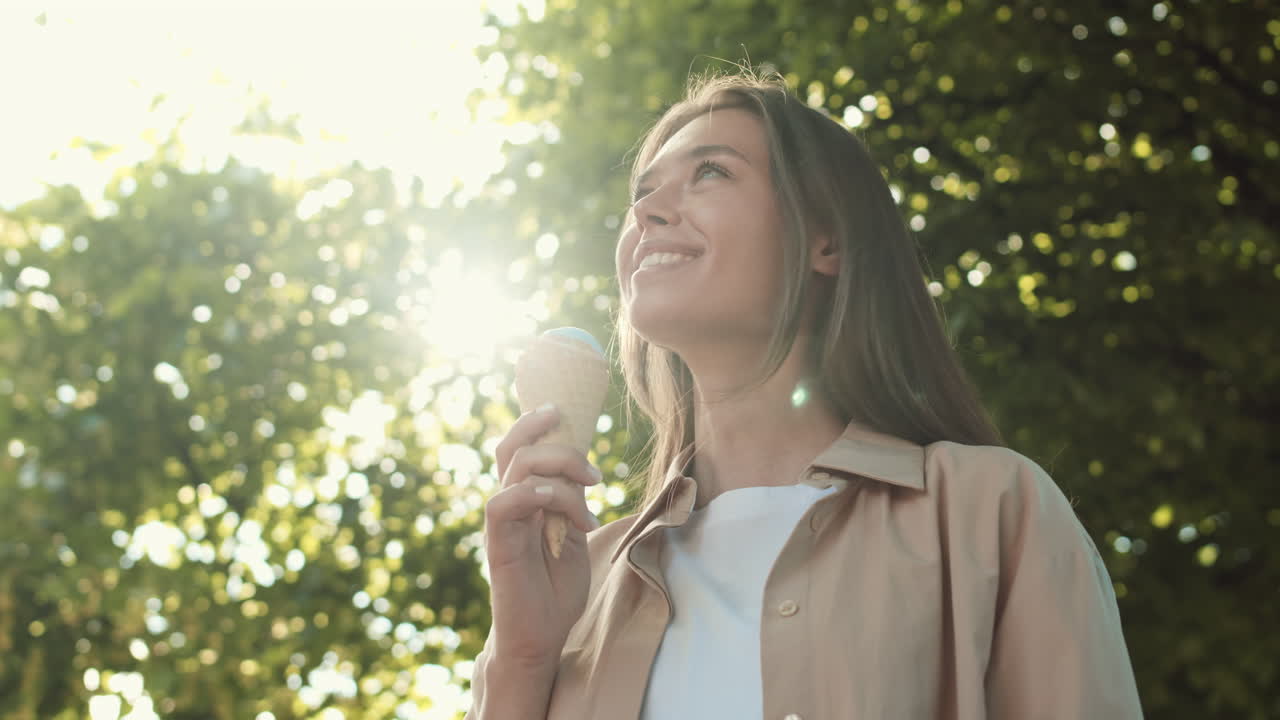 Happy Woman with Icecream in Park