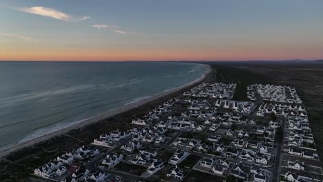 aerial flyover of dwarskersbos municipality on africa desert coastline