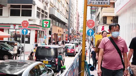 pedestrians navigate a bustling urban street