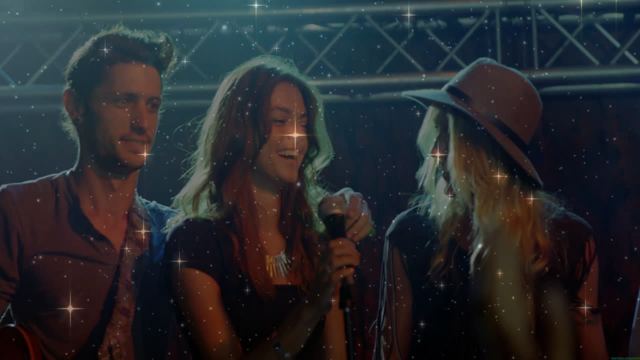 Bandmates performing on music stage, featuring truss lighting and star filter animations