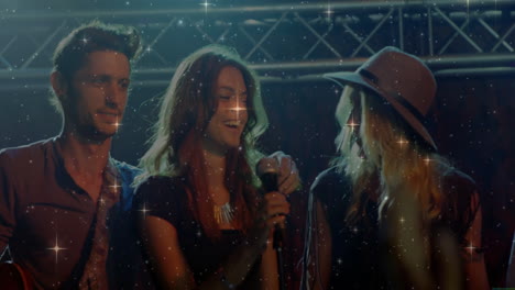 bandmates performing on music stage, featuring truss lighting and star filter animations